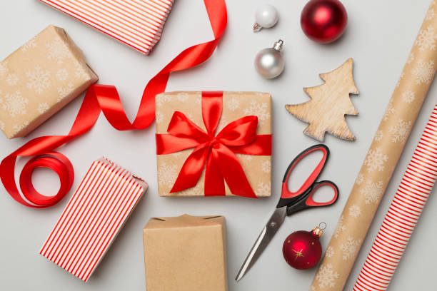 istock Gift boxes, paper's rools and decorations on color background, top view 1640408008