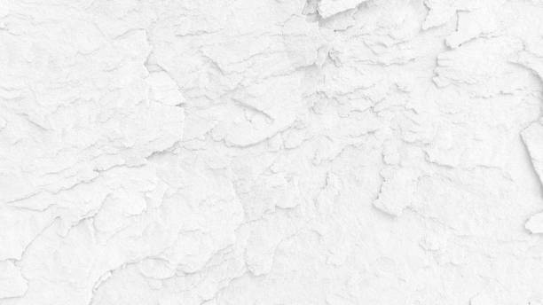 istock White wall surface of the white stone texture rough, gray tone. Use this for wallpaper or background image rock backdrop. There is a blank space for text. 1640421991
