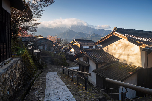 Magome juku preserved old Japanese town of Nakasendo with central alps mountain at sunrise, Kiso valley in  Nakatsugawa, Gifu Prefecture, Japan. Famous travel landmark.