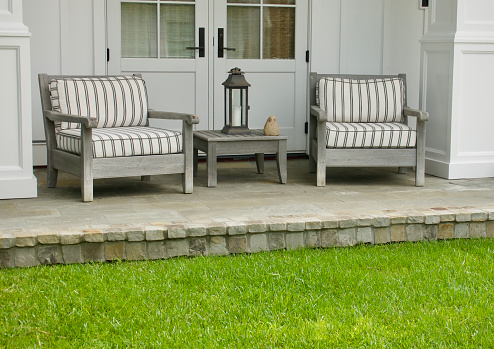 Teakwood outdoor furniture on the front porch