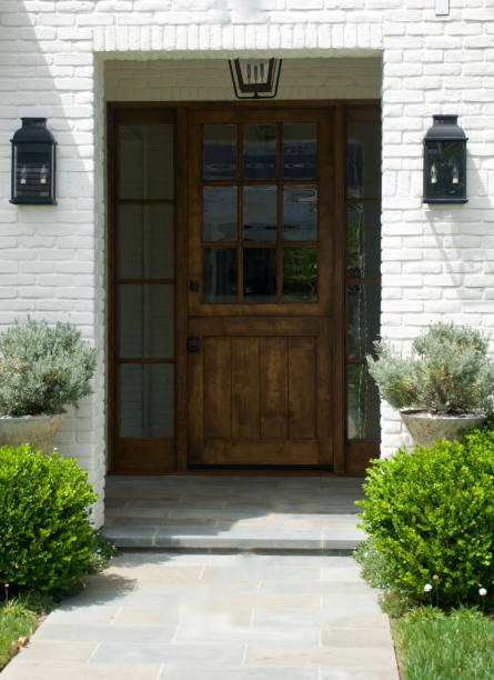 istock White brick building with rustic wood front door 1640461976