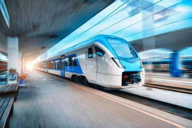 istock Blue high speed train in motion on the railway station. Fast moving modern intercity train and blurred background. Railway platform. Railroad in Slovenia. Commercial. Passenger railway transportation 1640463103