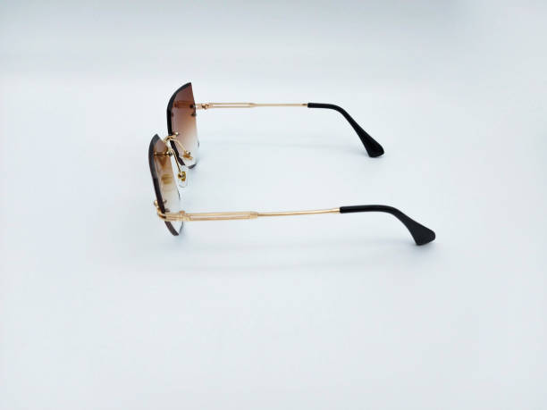 istock Golden sunglasses with brown lenses cat's eye style side view 1640478619