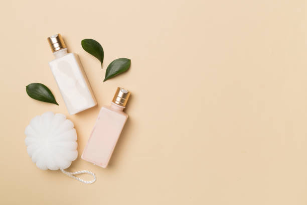 istock Shower gel with washcloth on color background, top view 1640489313