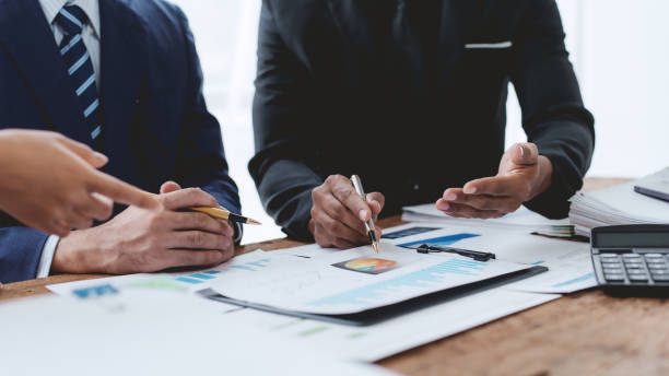 istock Business people meeting explaining the financial graph data and marketing plan. Group of business people at meeting assessment the state of business investment and marketing. 1640515606