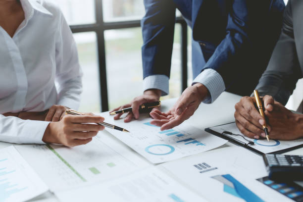 istock Business people meeting explaining the financial graph data and marketing plan. Group of business people at meeting assessment the state of business investment and marketing. 1640515607