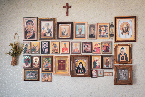 Historical Jesus paintings hanging on the wall of a house, symbols of Christianity, Domestic life