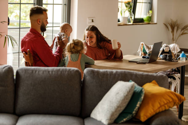 istock Parents cuddling and bonding with their two little kids 1640524813