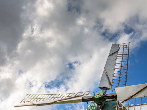 istock Blades of a windmill against a cloudy sky 1640525855