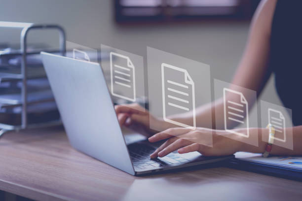 istock Business document icon. Business woman using laptop to store documents and search for information. Document management with icons on virtual screen ERP. 1640542394