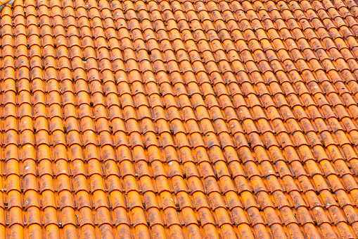 Tropical shingle layer on roof, natural pattern house or cottage. Texture background. Nature material.