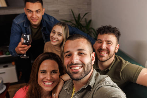 istock Smiling at camera as if they are taking selfies 1640570414