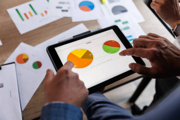 istock Businessman scrolling through various data on digital tablet during a meeting 1640592651