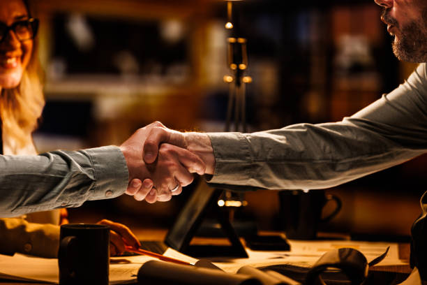 istock Business people shaking hands after a successful meeting 1640594233