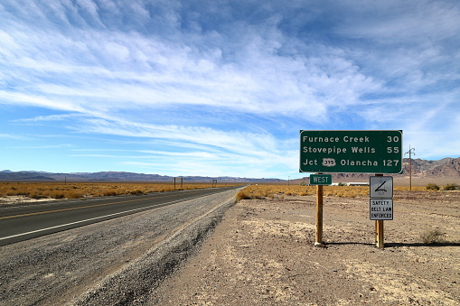 Mileage sign along California state route 190, CA-190, next to Death Valley Junction, California, USA