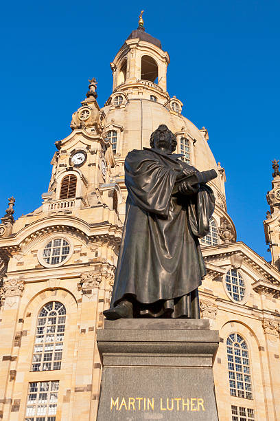 Statue of the famous church reformer and bible translator in front of baroque Church of Our Lady - Frauenkirche