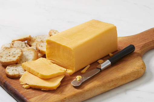 Block of Processed Cheese with Toasted Baguette Slices