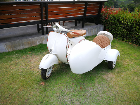 Vintage scooter motorcycle with sidecar.