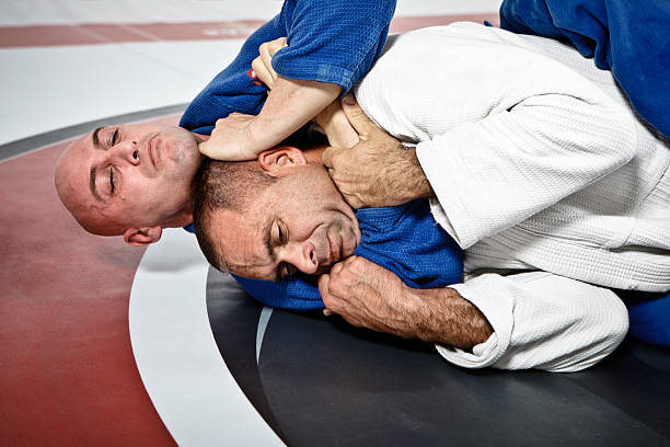Jiu-Jitsu Submission Hold Two men practicing Brazilian Jiu Jitsu. brazilian jiu jitsu photos stock pictures, royalty-free photos & images
