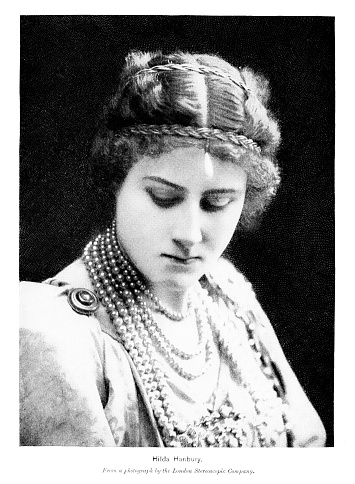 Portrait of Hilda Louise Hanbury (née Alcock;  January 16, 1875 – December 23, 1961), a British stage actress. Her cousin is actress Julia Neilson. Photograph published 1896. Original edition is from my own archives. Copyright has expired and is in Public Domain.
