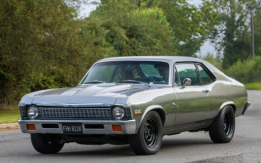 Whittlebury,Northants,UK -Aug 26th 2023:  1972 Chevrolet Nova travelling on an English country road