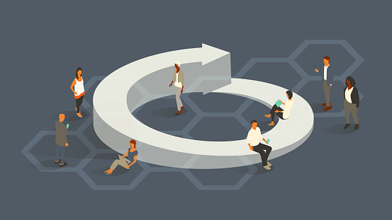 A group of eight people are dressed for business, illustrating the concept of a life cycle as they gather around a three-dimensional circular arrow. Diverse men and women use digital devices. Isometric vector presented in a 16x9 artboard, over a slate gray background and a hexagonal honeycomb pattern.