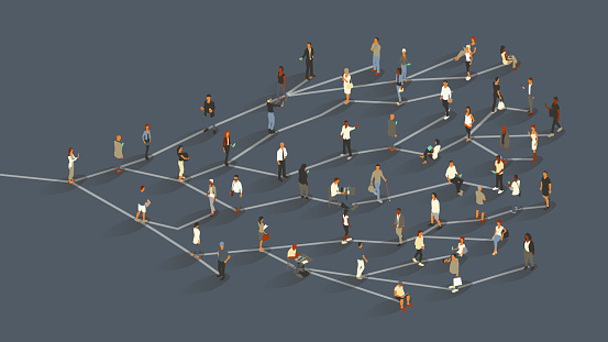A group of approximately 50 people illustrate the concept of the network effect, or viral growth, as they stand on branch-like lines radiating from a single source. Beginning with one woman, a message or idea branches to two additional people, and so on, ultimately effecting a large crowd. Diverse men and women use digital devices, primarily smartphones. Isometric vector presented in a 16x9 artboard, over a slate gray background.
