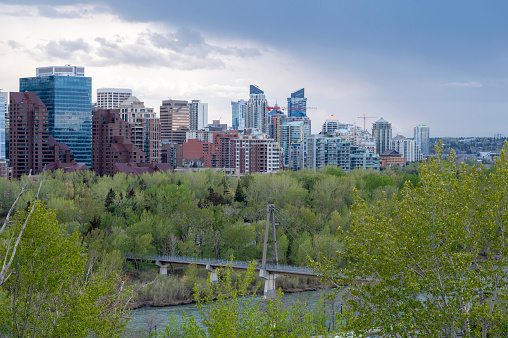 Calgary skyline panorama at night with Bow River and Centre Street Bridge.