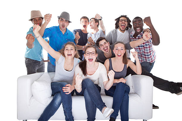 Group Of Friends Enjoying Watching Television stock photo