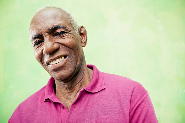 istock Portrait of elderly black man looking and smiling at camera 164070955