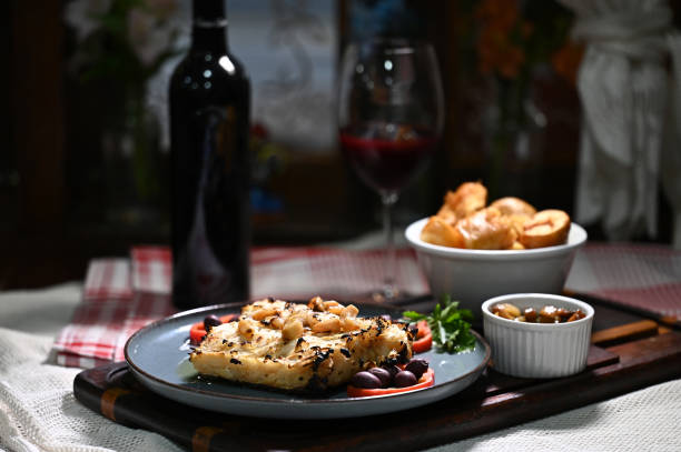 typical portuguese dish roasted codfish with onion garlic peppers and rustic babata lusitanian food fish