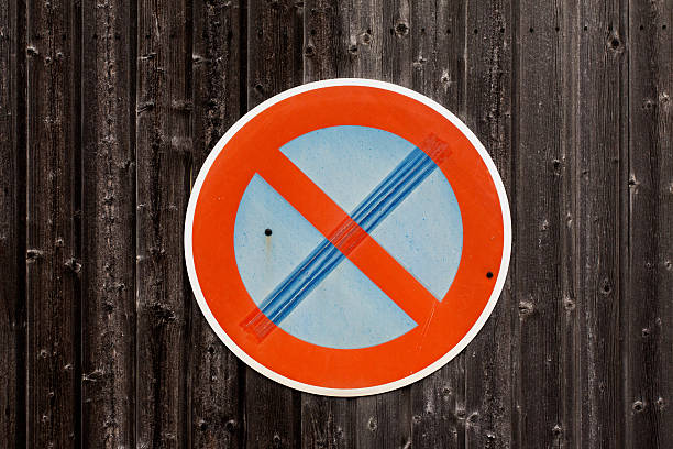 istock Traffic sign on a wooden background 164072378
