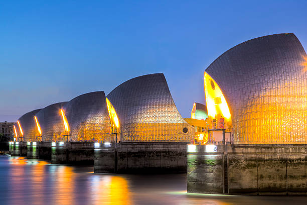 istock Thames Barrier And Canary Wharf, London UK 164072393