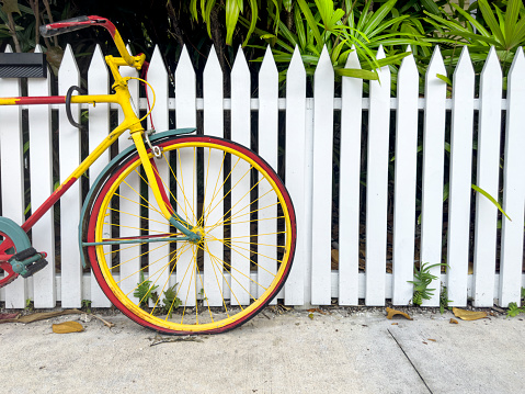 Colorful bicycle parked on residential district in Key West, Florida