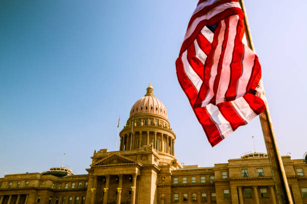 istock Idaho State Capitol and USA flag 164080888
