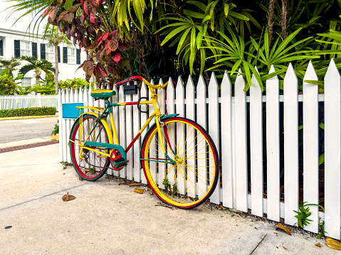 Colorful bicycle parked on residential district in Key West, Florida