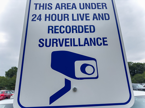 Security camera embodies vigilance, modern surveillance, privacy concerns, and a watchful society