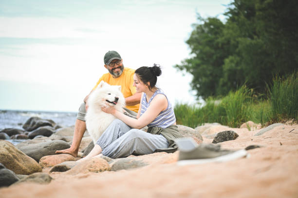 istock dad and daughter enjoy nature by the lake 1640836122