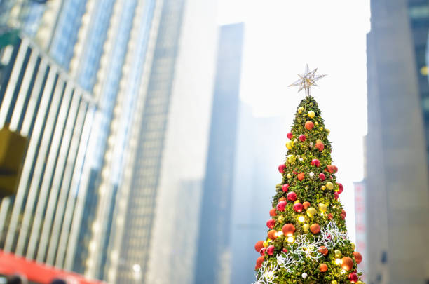 istock Large outdoor shiny Christmas tree at city square 1640838714