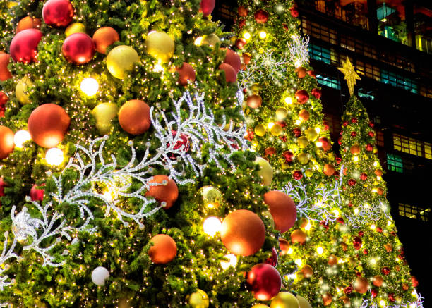istock Large Christmas tree glowing at city square at night 1640839238