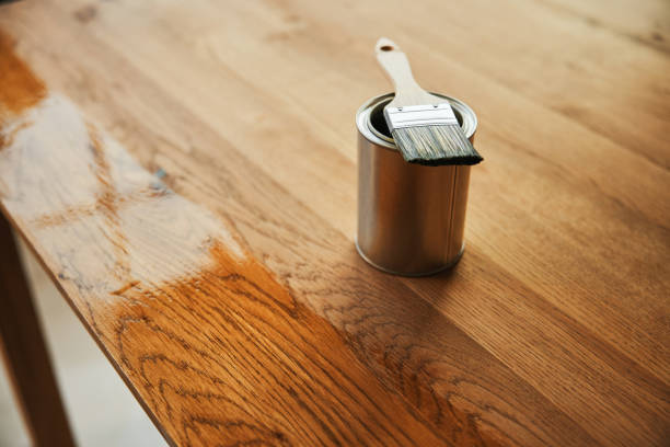 Oiling oak wood table stock photo