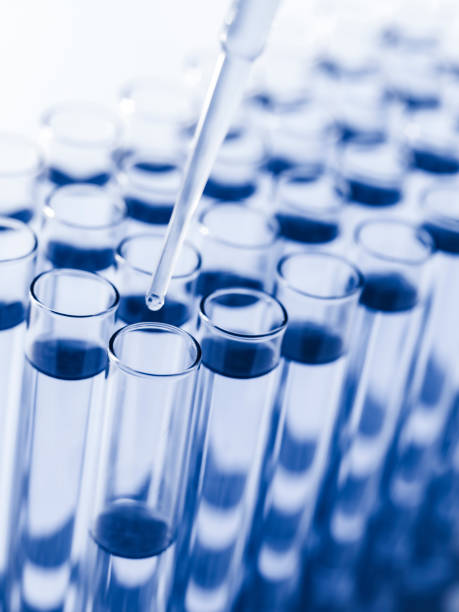 istock Droplet Falling from Pipette into Test Tube. 1640880242
