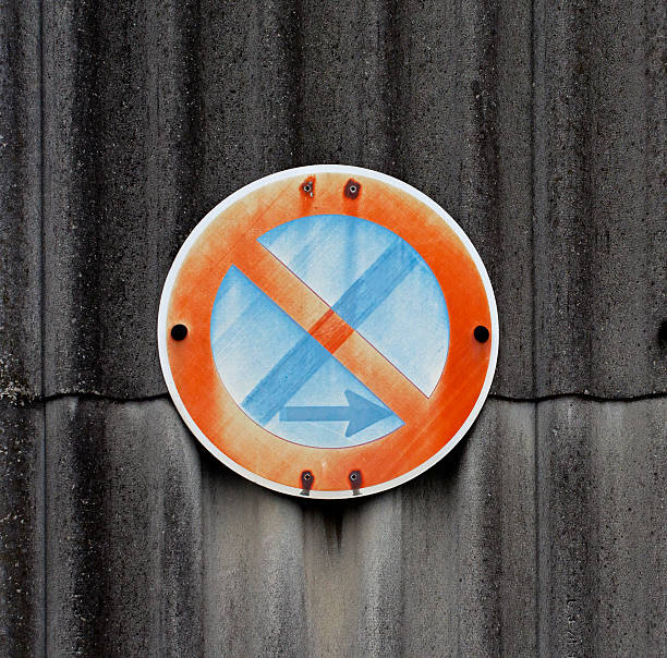 istock Traffic sign on a asbestos wall 164090114