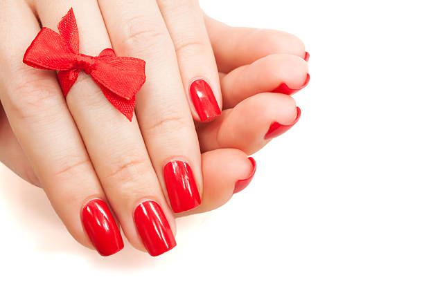 istock fingers with red manicure isolated 164090270