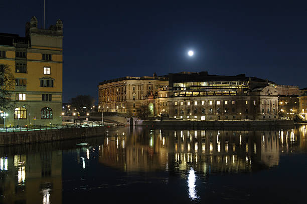 Central Stockholm by night Central Stockholm with the parliament house, governement buildings and the opera reflecting in Lake MalarenCentral Stockholm with the parliament house, royal castle and the moon reflecting in Lake Malaren strommen stock pictures, royalty-free photos & images