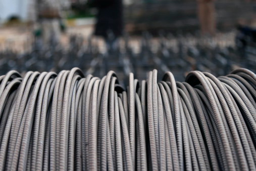 Steel construction rod commonly used to reinforce concrete walls and floors, called reebar.