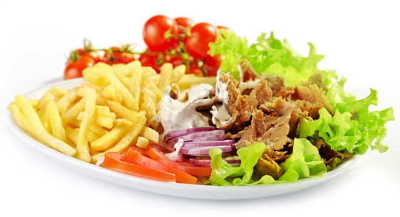 Plate of kebab gyros and vegetables