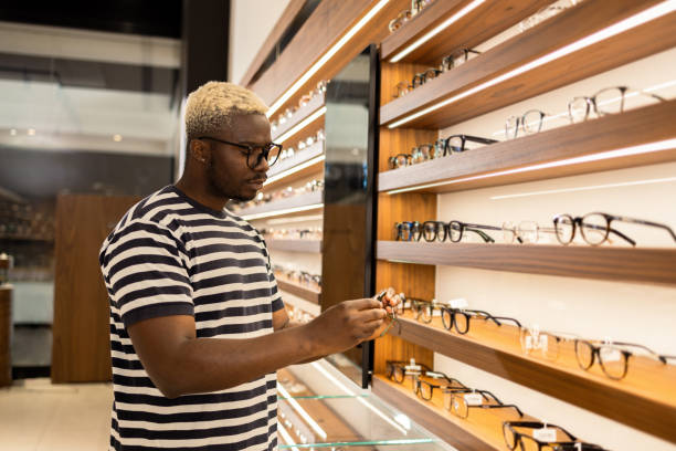 istock Man buying glasses in the store 1641051690