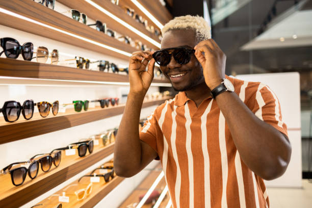 istock Happy young African American man purchasing glasses 1641057317