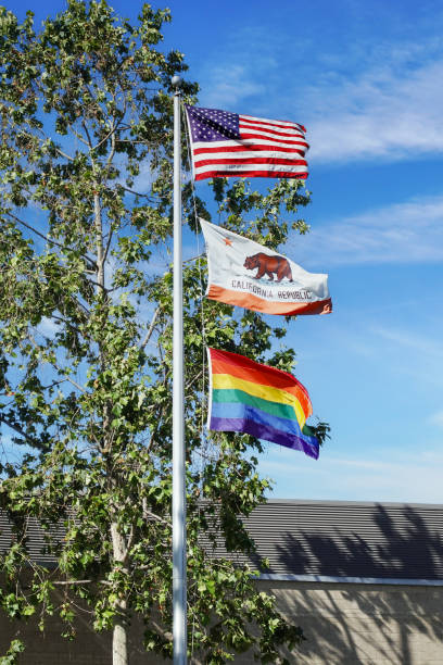 istock A US, California state and Pride flag flutter on flagpole in southern California 1641062212